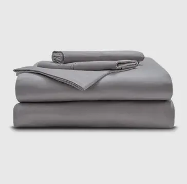 A folded grey sheet set with pillowcases